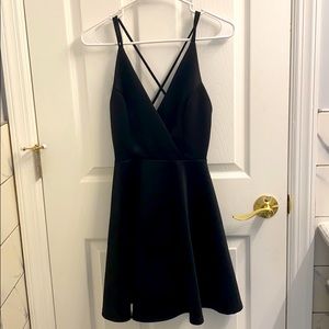 Open back, black strapped dress